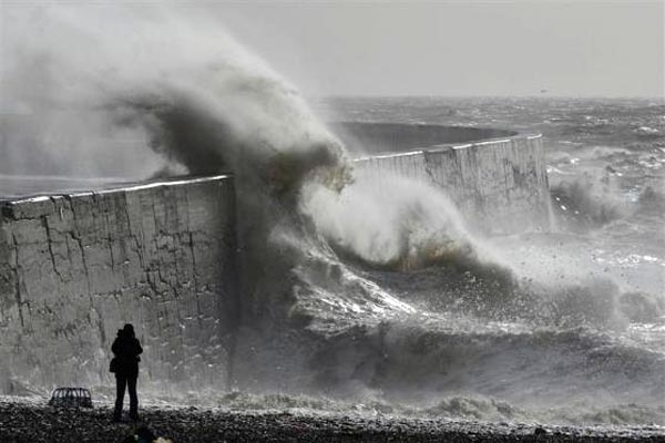 Two people killed as more storms batter Britain
