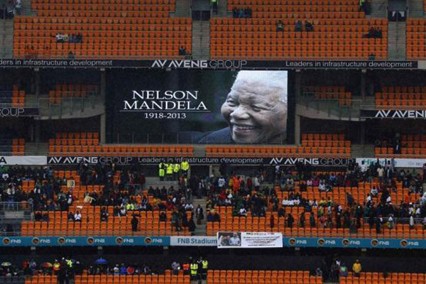 Leaders gather, thousands sing in rain in farewell to Mandela