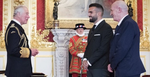Turkish Cypriot Mete Coban received an MBE from Prince Charles