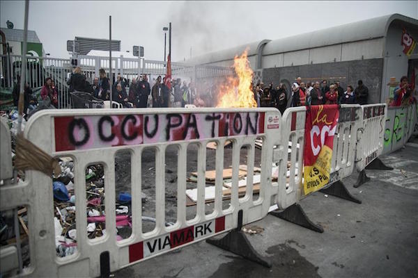 Nearly 100 arrested in labor bill protests in France