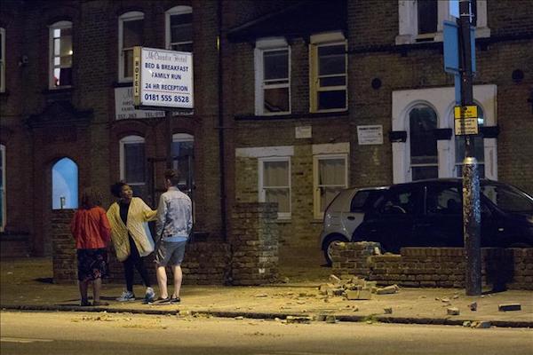 Clash between protesters and riot police in East London