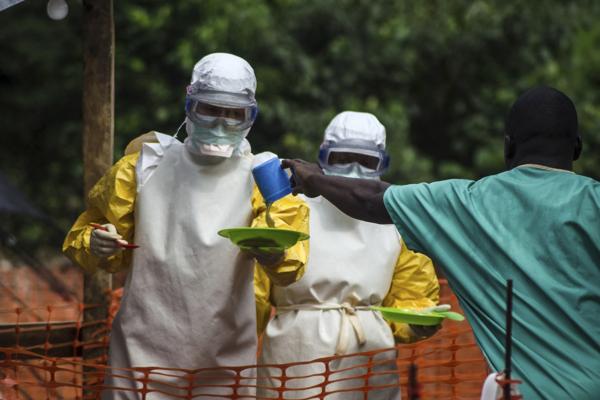 first to be diagnosed with Ebola in UK after working in Sierra