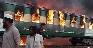 Train fire in northeast Pakistan kills 65