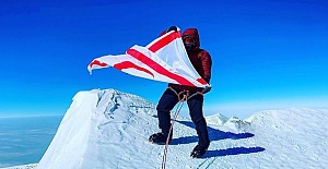 Turkish Cypriot mountaineer waves the flag of TRNC on the summit of Mount Vinson, the highest point in Antarctica