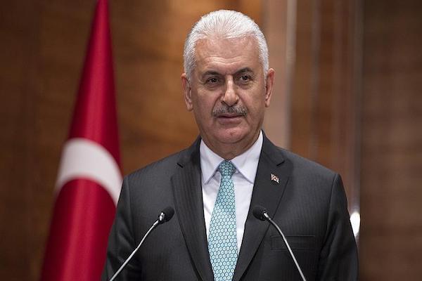 Turkeys PM urges Turkish ex pats to develop ties with UK